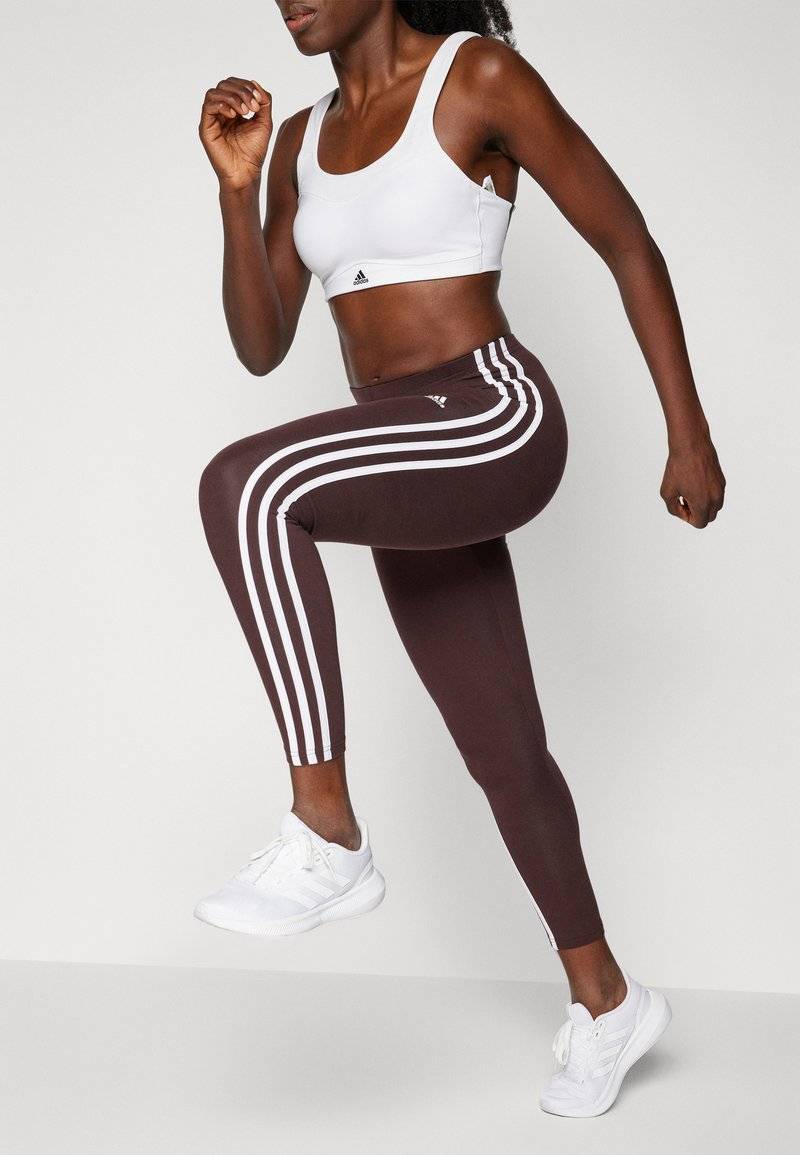 adidas Sportswear adidas Sportswear ESSENTIALS 3 STRIPES HIGH WAISTED - Leggings - shadow brown Preisnachlass