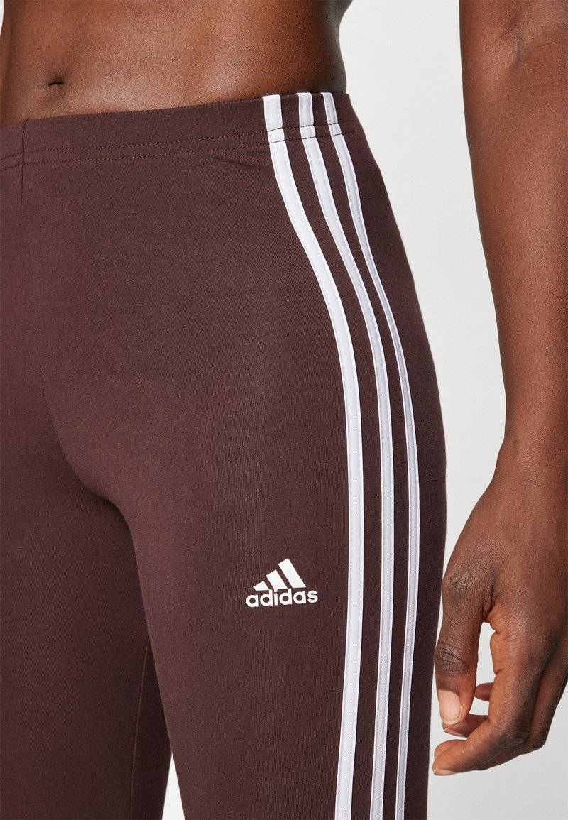 adidas Sportswear adidas Sportswear ESSENTIALS 3 STRIPES HIGH WAISTED - Leggings - shadow brown Preisnachlass