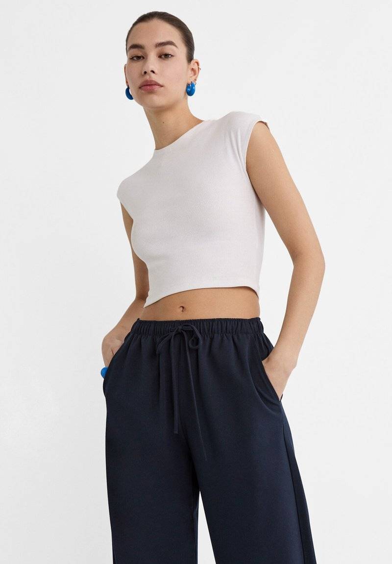 Stradivarius Stradivarius LONG FLOWING - Trousers - mottled dark blue Bis zu 55% Rabatt