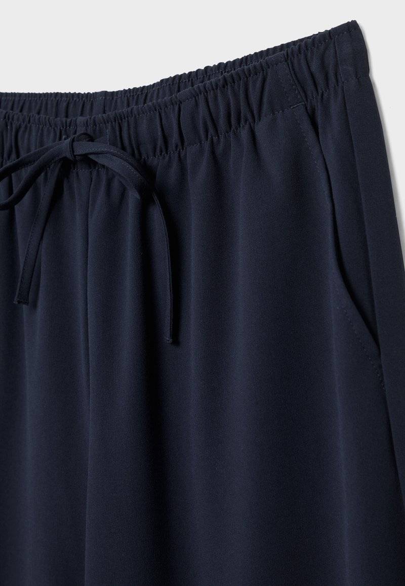 Stradivarius Stradivarius LONG FLOWING - Trousers - mottled dark blue Bis zu 55% Rabatt
