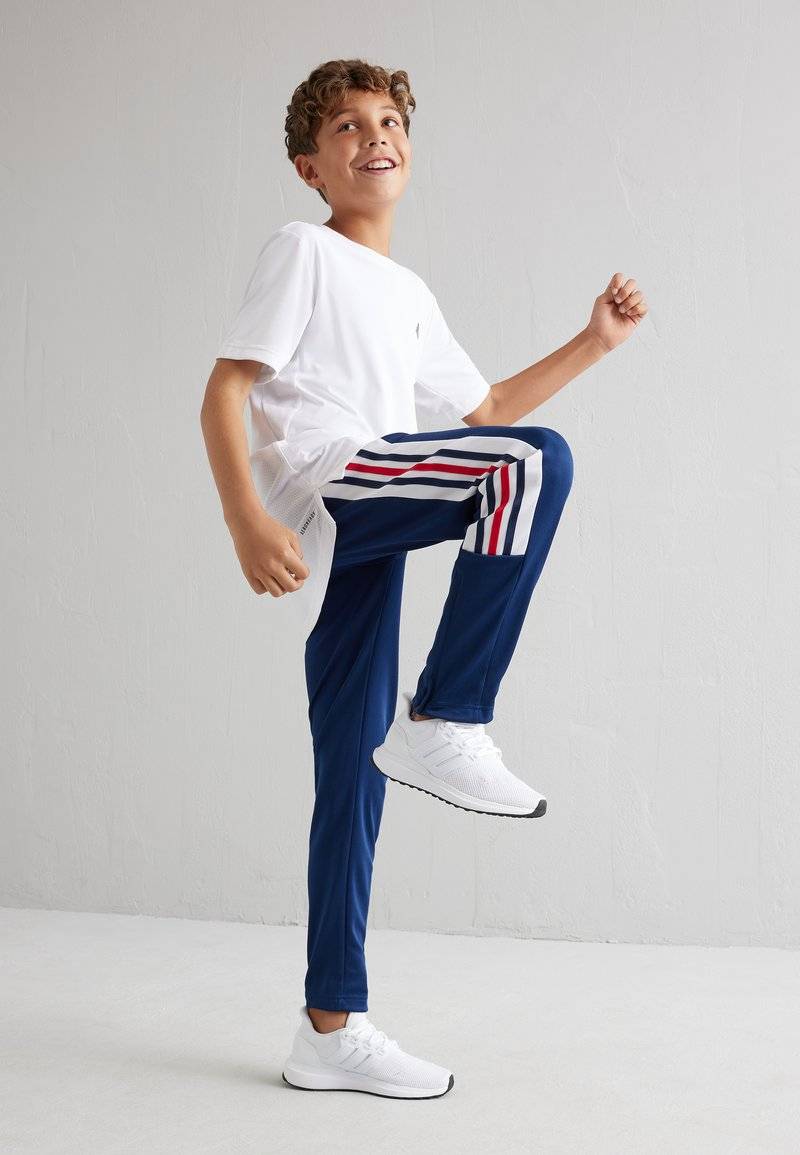 adidas Performance adidas Performance TIRO NATIONS PACK UNISEX - Tracksuit bottoms Clearance-Verkauf
