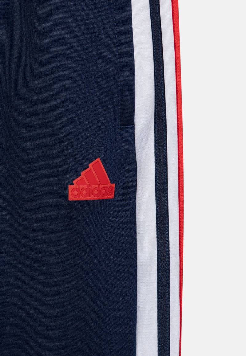 adidas Performance adidas Performance TIRO NATIONS PACK UNISEX - Tracksuit bottoms Clearance-Verkauf