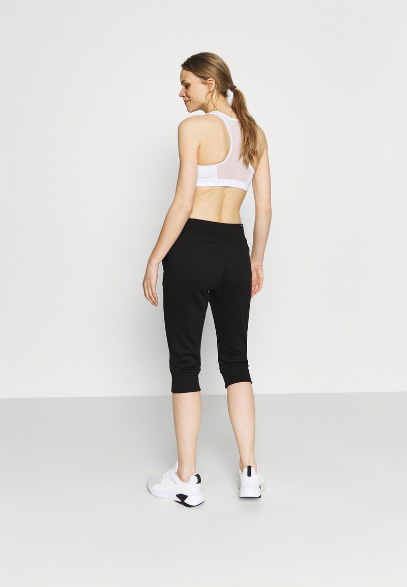 Puma Puma CAPRI - 3/4 sports trousers - black Bis zu 50% Rabatt