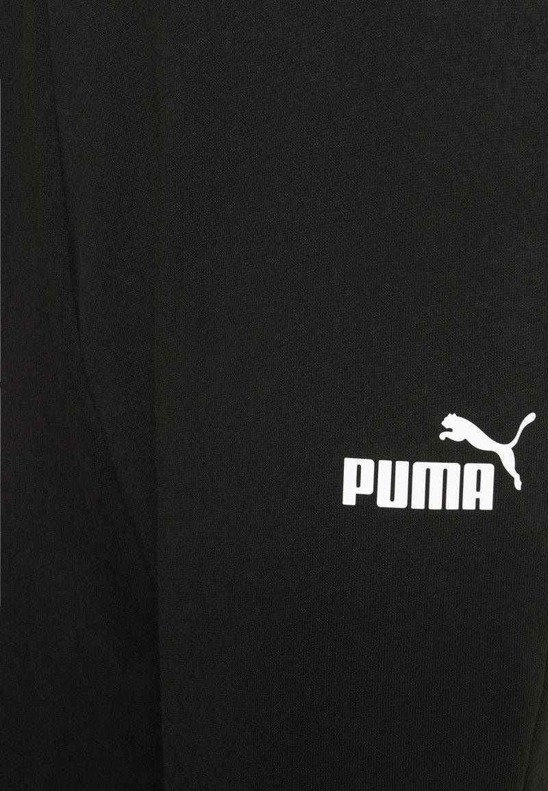 Puma Puma CAPRI - 3/4 sports trousers - black Bis zu 50% Rabatt