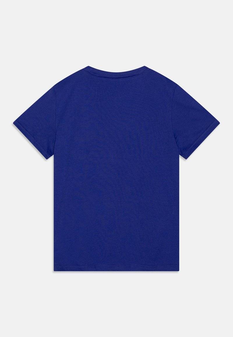 Puma Puma LOGO TEE UNISEX - Print T-shirt - lapis lazuli Meist gekauft