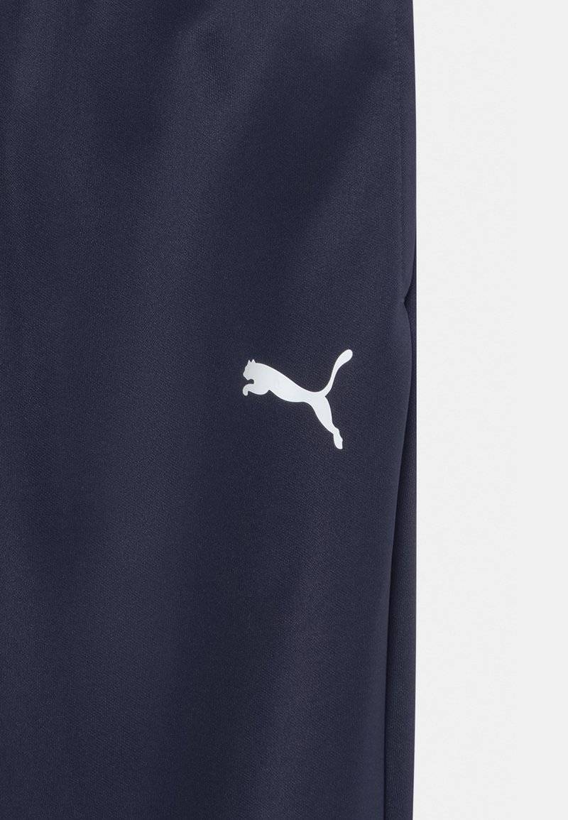 Puma Puma TEAMRISE POLY TRAINING UNISEX - Tracksuit bottoms Riesige Rabatte