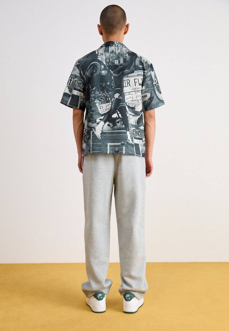 Nike Sportswear Nike Sportswear BUNGIE PANT - Tracksuit bottoms - grey heather Weihnachtsangebot
