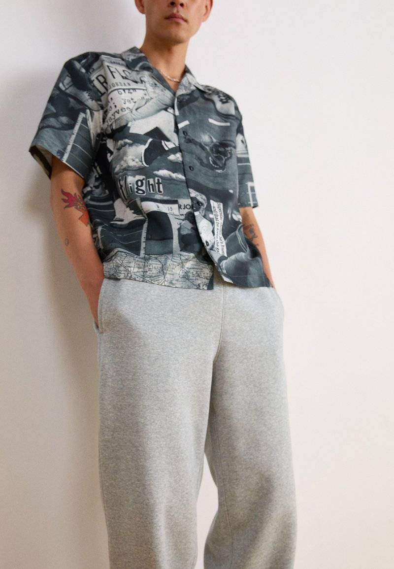 Nike Sportswear Nike Sportswear BUNGIE PANT - Tracksuit bottoms - grey heather Weihnachtsangebot