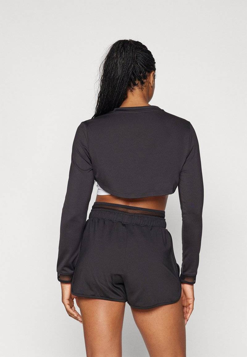 Puma Puma PAMELA REIF CROPPED - Long sleeved top - black Super Rabatt