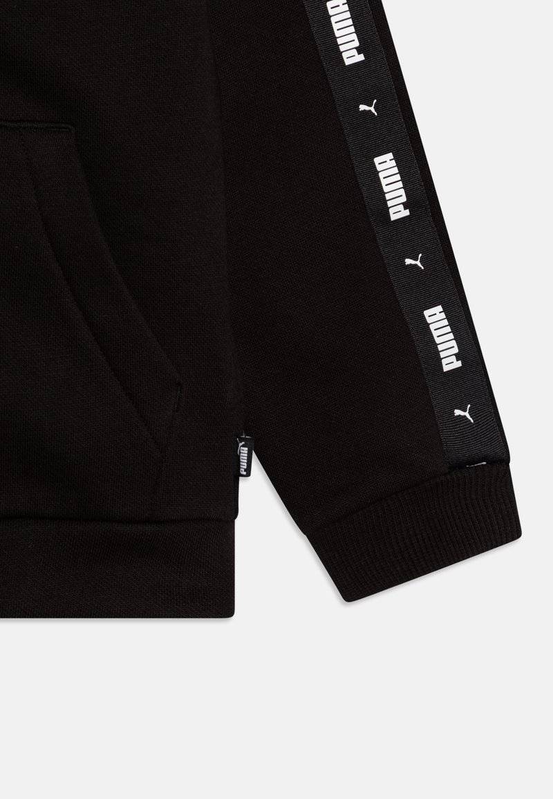 Puma Puma TAPE SWEAT SUIT UNISEX SET - Tracksuit - black Auslauf
