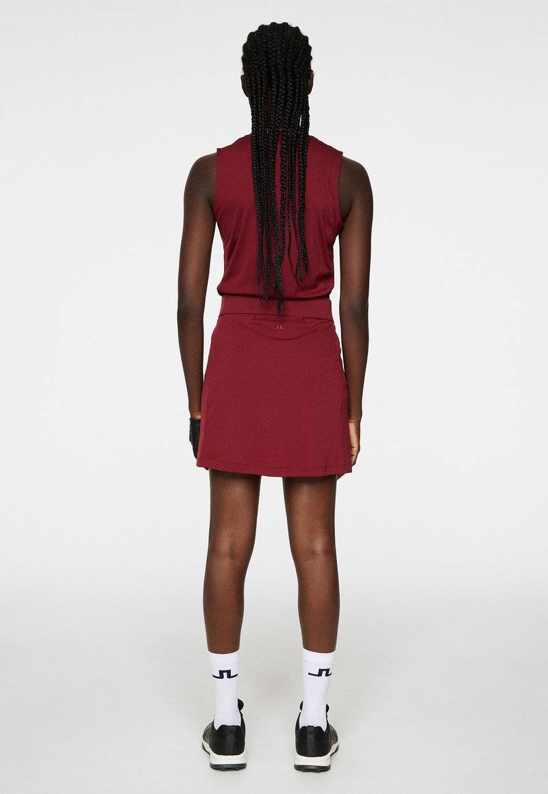 J.LINDEBERG Sports J.LINDEBERG Sports AMELIE MID - Sports skirt - cabernet Rabatt