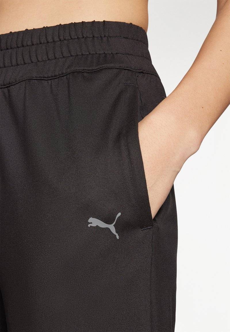 Puma Puma STUDIO FOUNDATIONS - Tracksuit bottoms - black Kostenloser Versand international