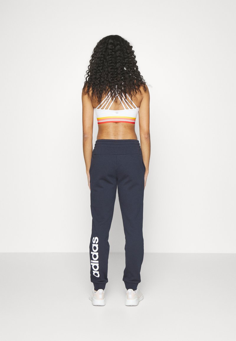 adidas Sportswear adidas Sportswear ESSENTIALS LINEAR CUFFED - Tracksuit bottoms - legend ink Neuheiten