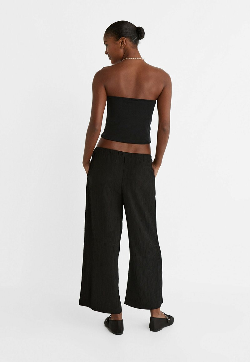 Stradivarius Stradivarius FLOWING CULOTTES - Trousers - black Super Rabatt
