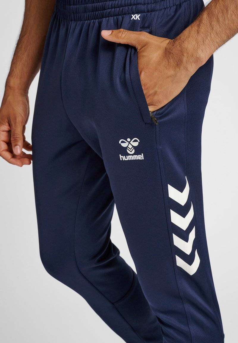 Hummel Hummel CORE XR TRAINING PANTS - Tracksuit bottoms - marine Speichern exportieren